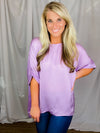 Top features a soft silk material, round neck line, short sleeves, oversized fit and runs true to size!-lavender