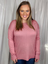 Top features a solid base color, long sleeves, round neck line, side hem slit detail, soft material and runs true to size!-pink