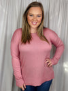 Top features a solid base color, long sleeves, round neck line, side hem slit detail, soft material and runs true to size!-pink