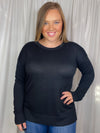 Top features a solid base color, long sleeves, round neck line, side hem slit detail, soft material and runs true to size!-black