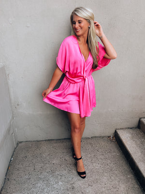 Romper features a solid base color, bright pink color, short sleeves, V-neck line, lovely silky material and runs true to size! 