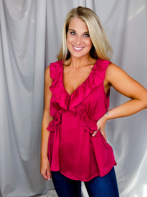 Top features a solid base color, V-neck line, short sleeves, baby doll fit, silk material and runs true to size!-magenta