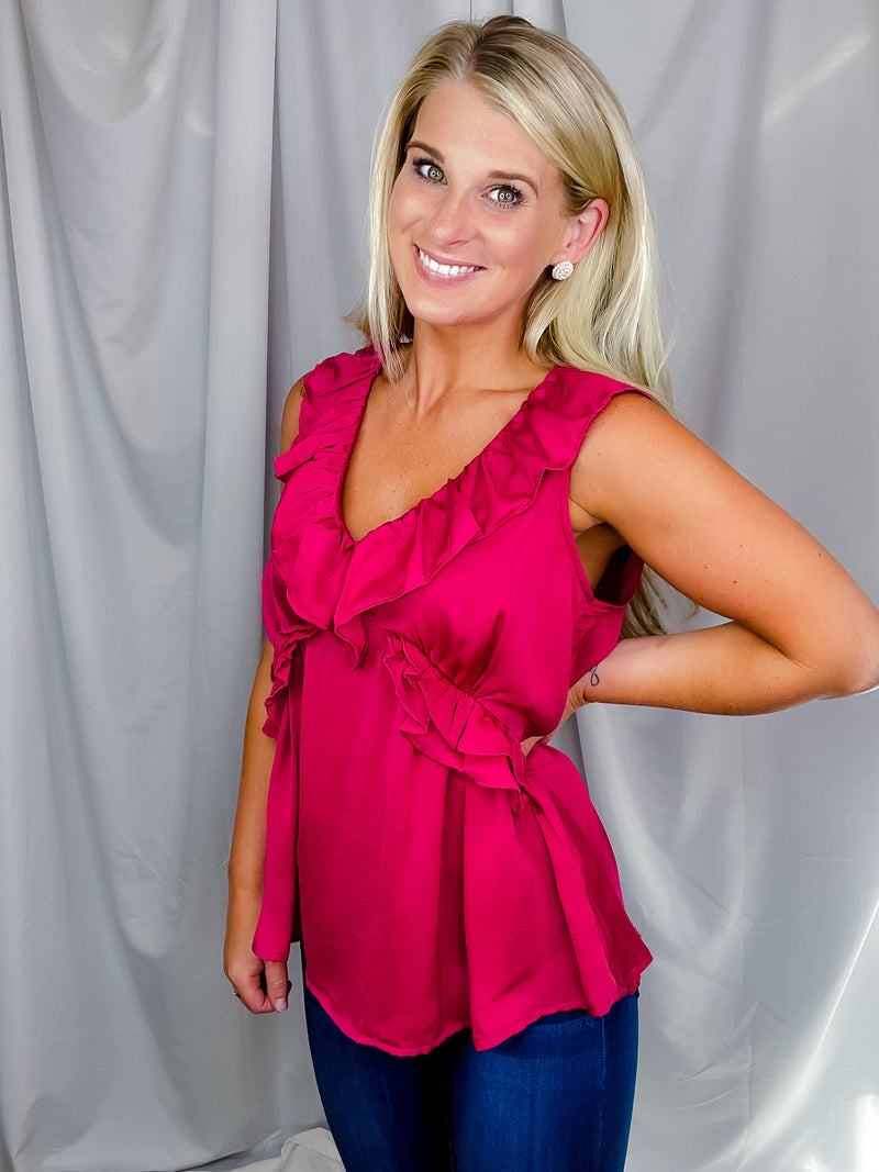 Top features a solid base color, V-neck line, short sleeves, baby doll fit, silk material and runs true to size!-magenta