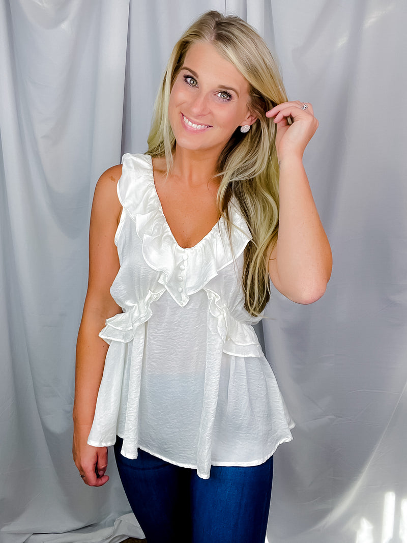 Top features a solid base color, V-neck line, short sleeves, baby doll fit, silk material and runs true to size!-off white