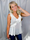 Top features a solid base color, V-neck line, short sleeves, baby doll fit, silk material and runs true to size!-off white