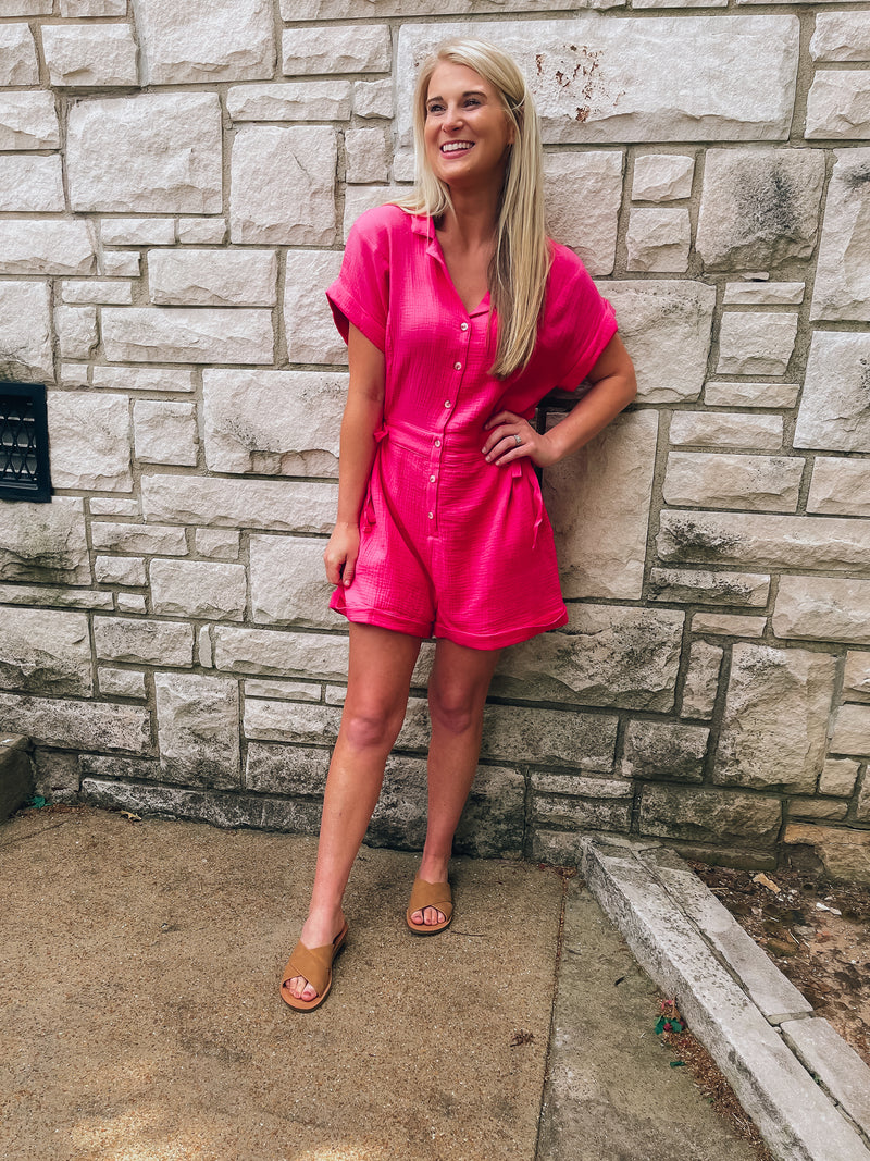 Romper features a soft light weight material, short sleeve detail, button down front detail, collar detail and runs true to size! -hot pink
