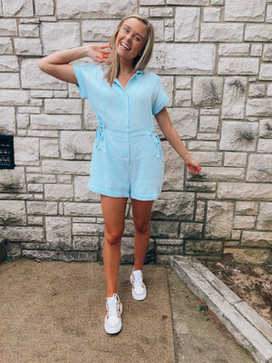 Romper features a soft light weight material, short sleeve detail, button down front detail, collar detail and runs true to size! -blue