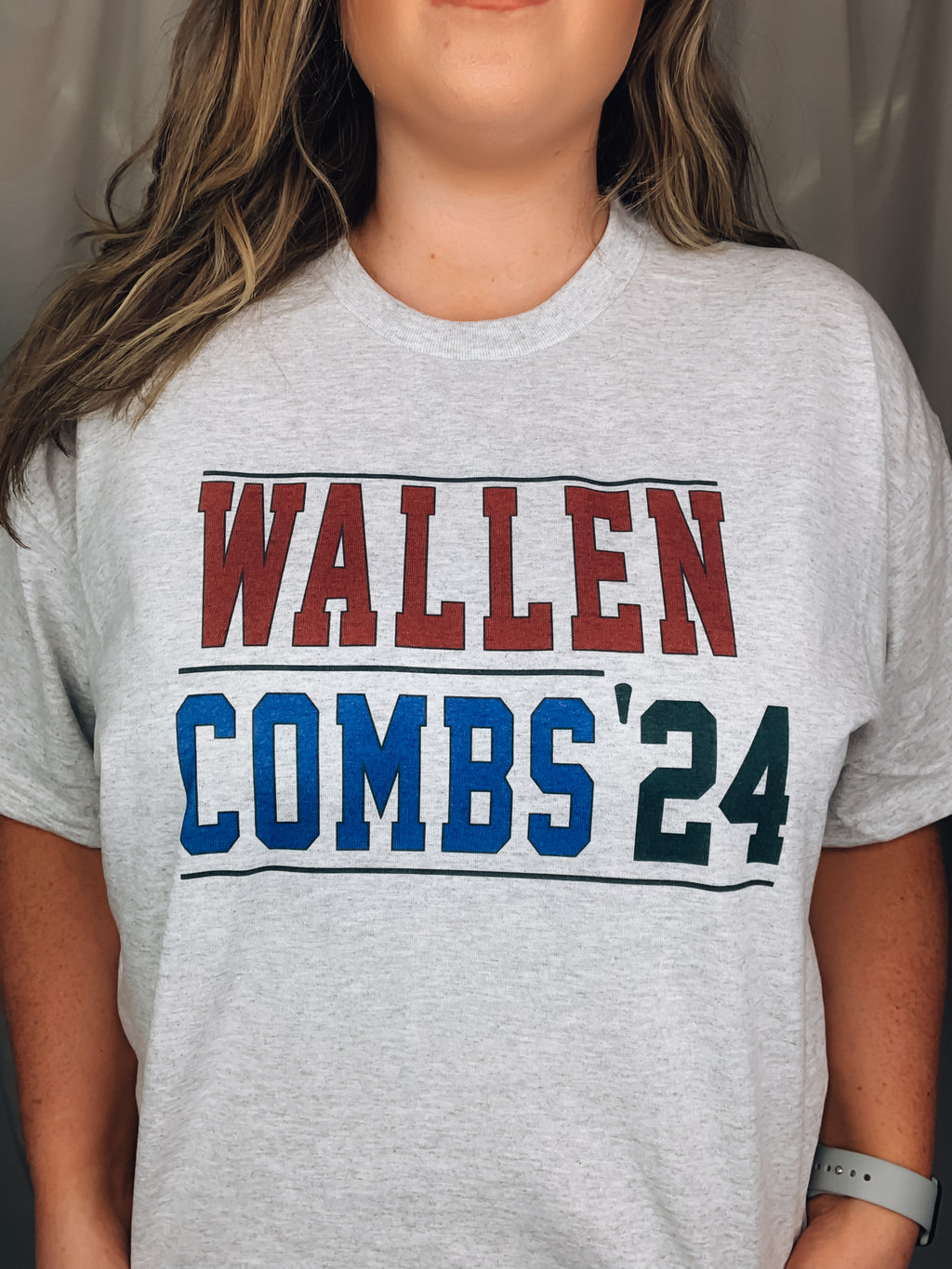 Graphic tee features a heathered gray base color with a red/ blue coloring. This tee is unisex fit, has a round neckline, and runs true to size!