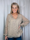 Top features a taupe base, black floral print, underlining, long sleeves, V-neck line, and runs true to size! 