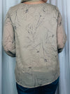 Top features a taupe base, black floral print, underlining, long sleeves, V-neck line, and runs true to size! 