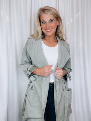 Jacket features a solid base color, lightweight suede material, 3/4 roll up sleeves, open front, tie waist, front pockets and runs true to size!-sage