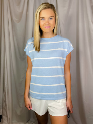 Top features a soft ribbed material, wide crew neck line, blue & white striped detail, flattering fit and runs true to size! 