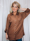 Top features a solid brown color, long roll up sleeves, button down detail, soft material and runs true to size! 