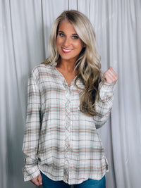 Top features a cream base, mint plaid detail, button down detail, long sleeve and runs true to size! 