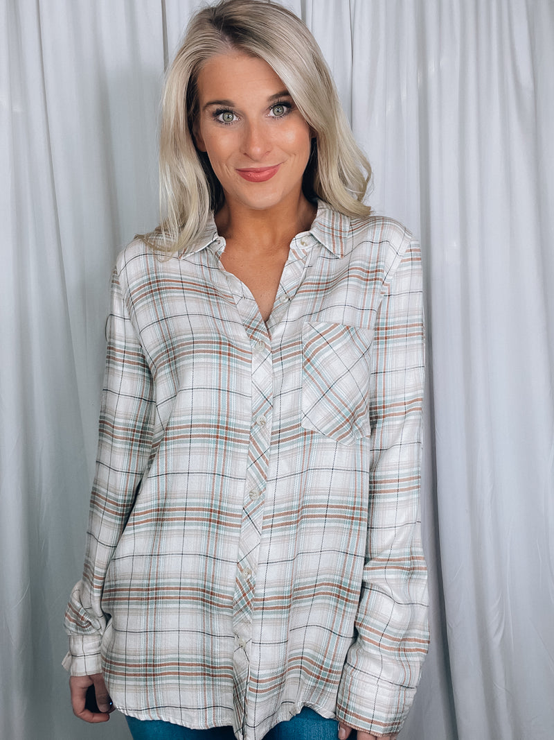 Top features a cream base, mint plaid detail, button down detail, long sleeve and runs true to size! 