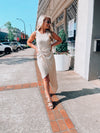 Dress features a solid base color, midi length, soft ribbed material, sleeveless detail, round neck line, wrap detail and runs true to size! -taupe