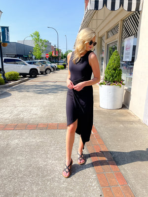 Dress features a solid base color, midi length, soft ribbed material, sleeveless detail, round neck line, wrap detail and runs true to size!-black