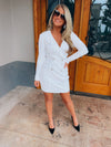 Dress features a white full sequin base, long sleeves, deep V-neck line, back zipper closure, faux double button front detailing, mini length and runs true to size! 