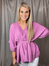 Top features a mauve color, V-neck line, kimono sleeves, fitted waist, lightweight material, flattering fit and runs true to size! 