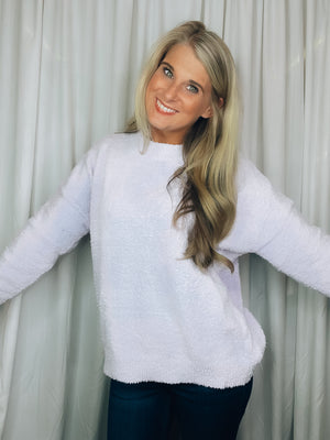 Sweater features a light lavender color, crew neck line, long sleeves, comfy fit and runs true to size! Soft and fuzzy material!