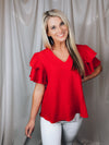 Top features a solid base color, textured look, ruffle sleeves, round neck line, lightweight material and runs true to size!-sage