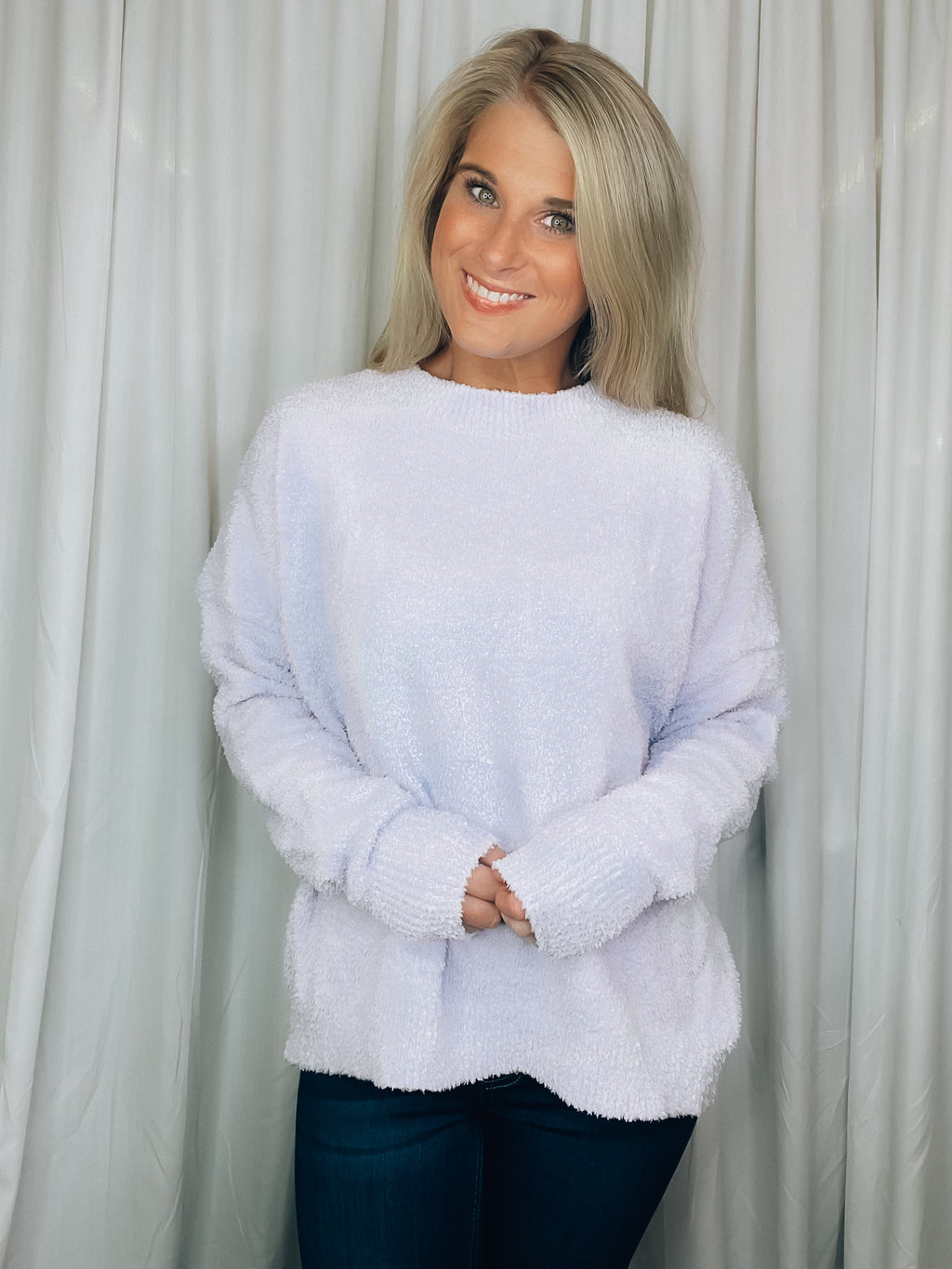 Sweater features a light lavender color, crew neck line, long sleeves, comfy fit and runs true to size! Soft and fuzzy material!