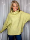 Sweater features a citrus color, long dolman sleeves, mock neck line, soft material and runs true to size