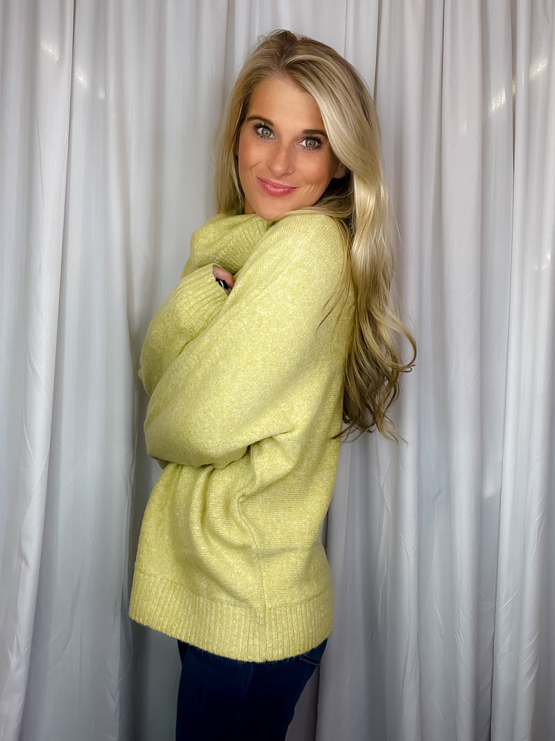 Sweater features a citrus color, long dolman sleeves, mock neck line, soft material and runs true to size