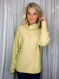 Sweater features a citrus color, long dolman sleeves, mock neck line, soft material and runs true to size