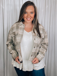 Shacket features a grey plaid print, long sleeves, button up detail, relaxed fit and runs true to size!   - Plaid casual button down jacket - Side slit - Long sleeve - Pocket patched