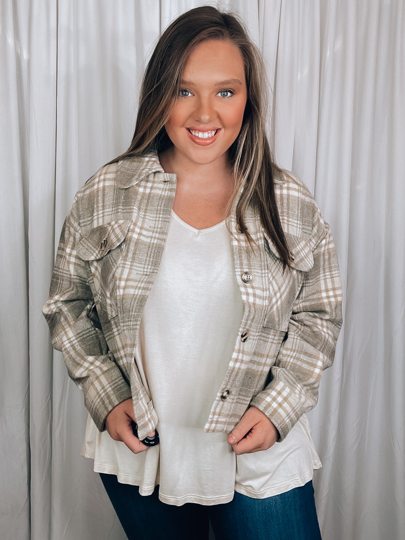 Shacket features a grey plaid print, long sleeves, button up detail, relaxed fit and runs true to size!   - Plaid casual button down jacket - Side slit - Long sleeve - Pocket patched