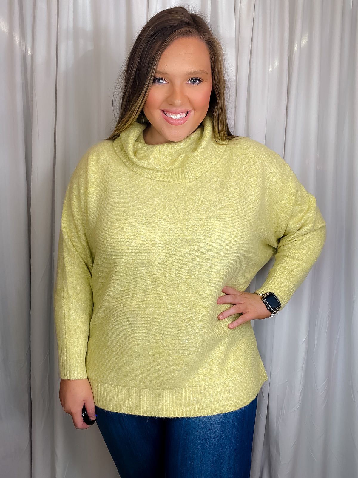 Sweater features a citrus color, long dolman sleeves, mock neck line, soft material and runs true to size