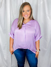 Top features a solid lavender color, V-neck line, high- low hem, cuffed short sleeves, light weight material and runs true to size! 