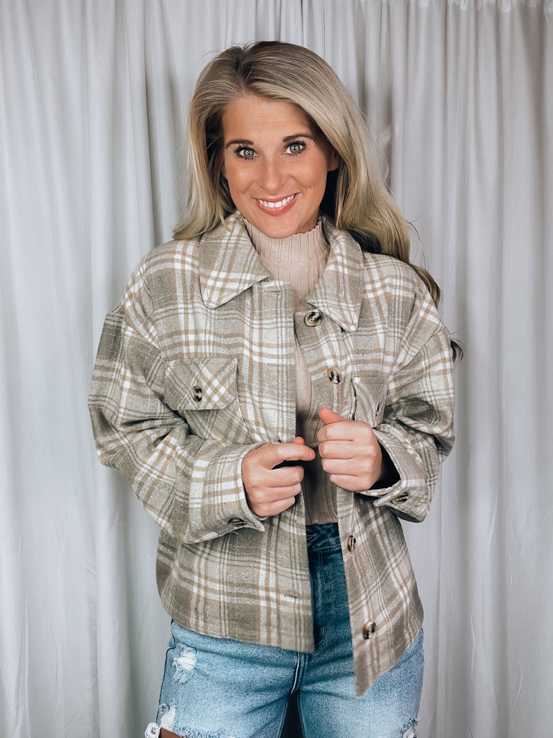 Shacket features a grey plaid print, long sleeves, button up detail, relaxed fit and runs true to size!   - Plaid casual button down jacket - Side slit - Long sleeve - Pocket patched