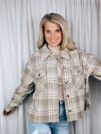 Shacket features a grey plaid print, long sleeves, button up detail, relaxed fit and runs true to size!   - Plaid casual button down jacket - Side slit - Long sleeve - Pocket patched