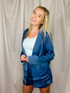This blazer features a solid base color, silky material, long sleeves with cuffed detail, and small side pockets. Runs true to size!