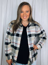 Flannel features a dark black and cream plaid detail, long sleeves, open front detail, collared detail, button up detail and runs true to size!