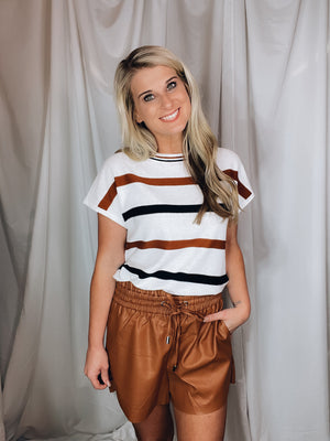 Top features a white base, copper & black striped print, short sleeves, lightweight material and runs true to size! 