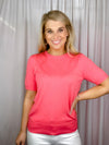 Top features a solid base color, crew neck line, short sleeves, and runs true to size!-coral