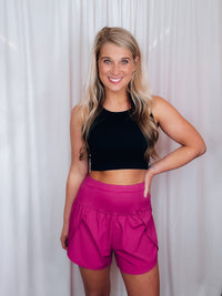 Shorts feature a solid color, high waisted detail, zippered back pocket, lightweight material, lined underneath and run true to size!-magenta