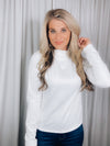 Top features a solid base color, long sleeve, mock neck line, fitted fit, and runs true to size! 
