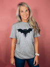 Graphic features a solid base colored tee, short sleeves, unisex fit, distressed black design and runs true to size!-grey