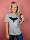 Graphic features a solid base colored tee, short sleeves, unisex fit, distressed black design and runs true to size!-grey