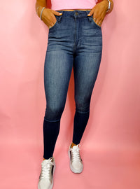 Bottoms feature a dark denim wash, skinny leg fit, frayed bottoms detailing, stretchy material and runs true to size! 