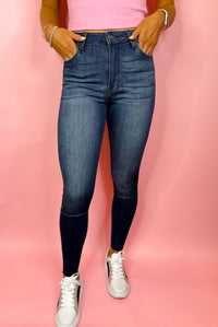 Bottoms feature a dark denim wash, skinny leg fit, frayed bottoms detailing, stretchy material and runs true to size! 