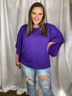Top features a solid base color, kimono sleeves, round neck line, light weight material and runs true to size!-purple