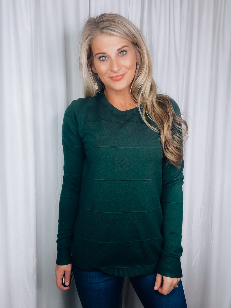 Top features a solid base color, long sleeves, horizontal line detailing, crew neck line and runs true to size! -hunter green