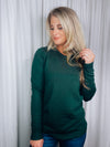 Top features a solid base color, long sleeves, horizontal line detailing, crew neck line and runs true to size! -hunter green