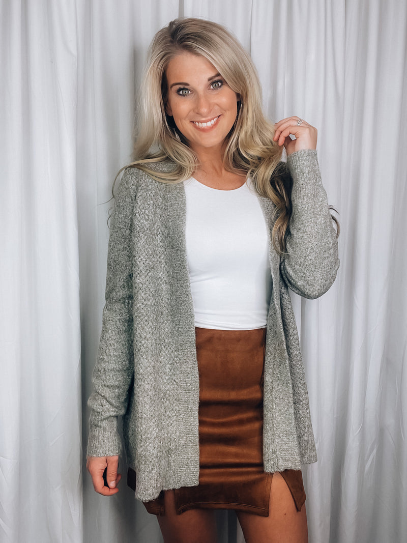 Cardigan features a heather olive tone, long sleeves, open front, super soft material and runs true to size! 