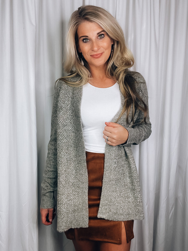 Cardigan features a heather olive tone, long sleeves, open front, super soft material and runs true to size! 